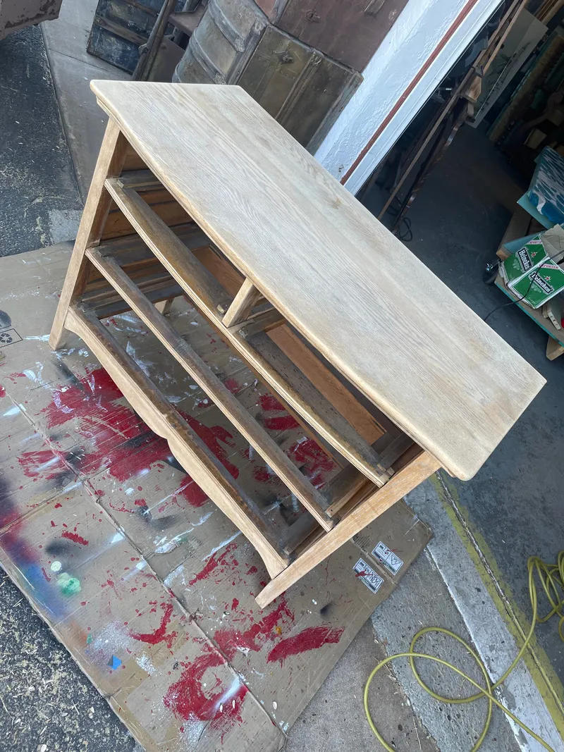 An oak dresser stripped back to bare wood with the drawers out, outside Sample Studios